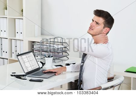Young Businessman Having Neckache