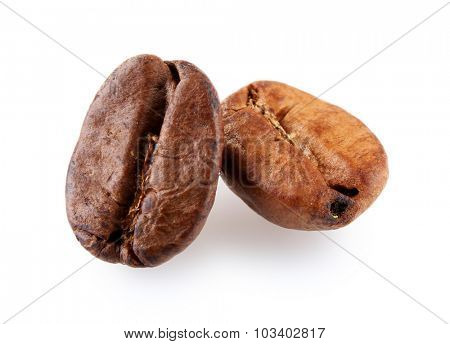 Brown coffee beans isolated on white