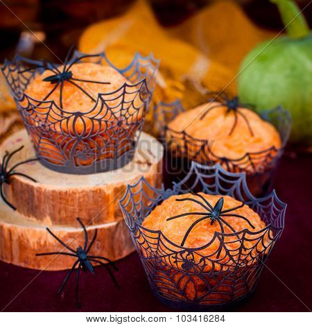 Halloween Pumpkin Muffins Decorated With Spiders And Spider Web