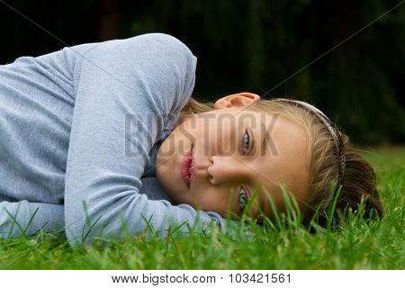 Cute child smiling in grass