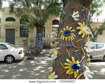 Tree Decorated With Yellow Plastic Flowers