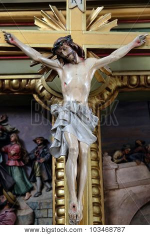ZAGREB, CROATIA - MAY 28: Cross on the altar in the Basilica of the Sacred Heart of Jesus in Zagreb, Croatia on May 28, 2015