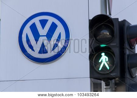 Green Colour On Traffic Light With Volkswagen Car Maker Logo