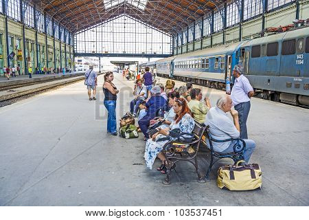 Unidentified People Wait At  The Train Station In Budapest