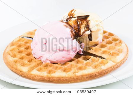 Vanilla And Strawberry Ice Cream On A Waffle