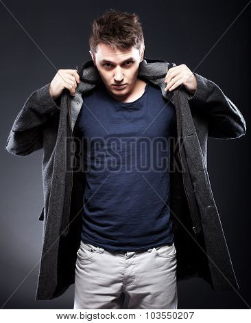 Handsome Smiling Young Man In Coat
