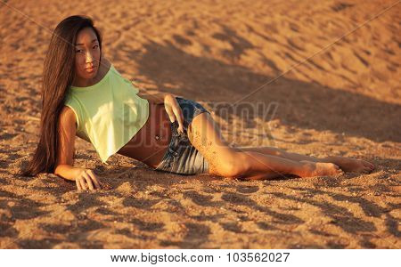 Woman sitting on the sand