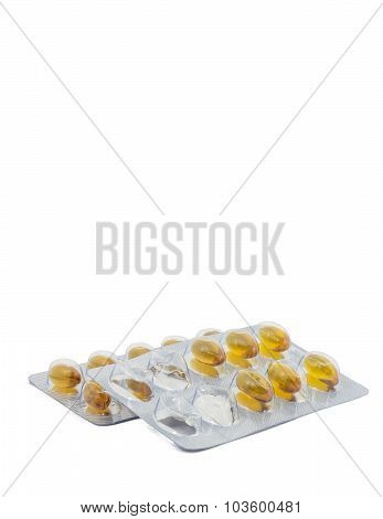 Yellow food supliment tablet with white background
