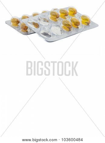 Yellow food supliment tablet with white background
