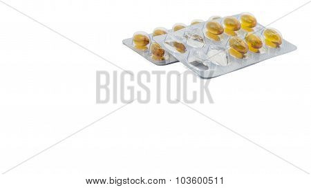 Yellow food supliment tablet with white background