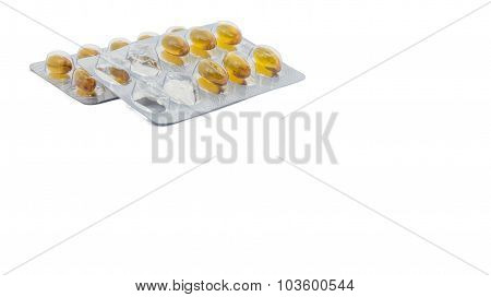 Yellow food supliment tablet with white background