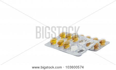 Yellow food supliment tablet with white background