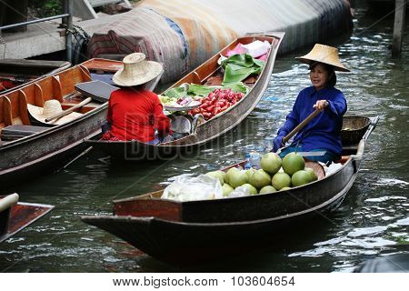 RATCHABURI THAILAND - JULY 5: Fruit boats at Damnoen Saduak floating market on July 5 2009 in Ratcha