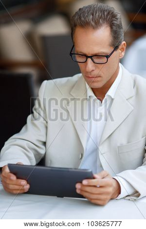 Nice man sitting in the cafe