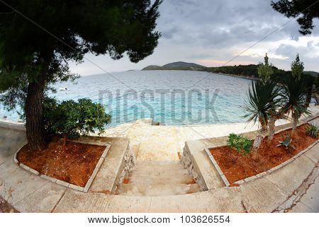 Stairs To The Beach, Clear Water And Cloudy Sky In Croatia Dalmatia