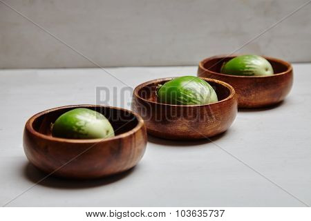 Green Eggplants In Wooden Plates