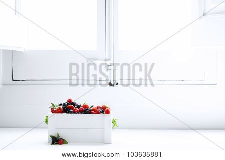 Berries Raspberries Blueberries Strawberries And Blackberries In A White Box Near The Window In Morn