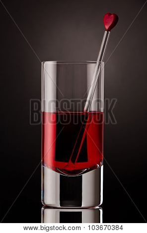Close up of a drink with glass stirrer