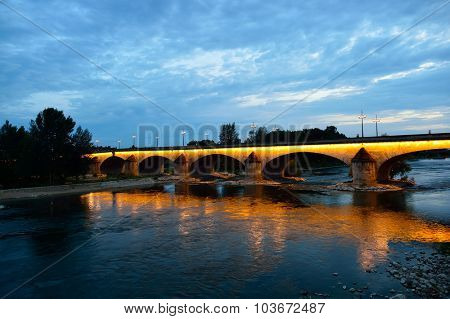ORLEANS, FRANCE - AUGUST 11, 2015: The George V Bridge at evening. The George V Bridge is a road and tram bridge that crosses the Loire in Orleans, France.