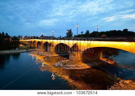 ORLEANS, FRANCE - AUGUST 11, 2015: The George V Bridge at evening. The George V Bridge is a road and tram bridge that crosses the Loire in Orleans, France.
