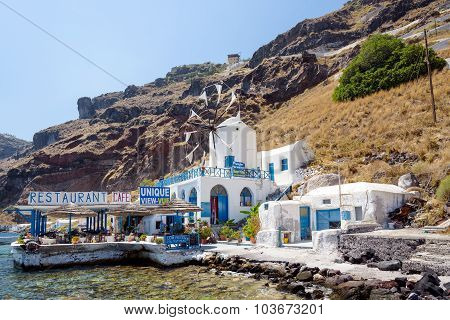Traditional greek tavern with with windmill, located at Tirasia island