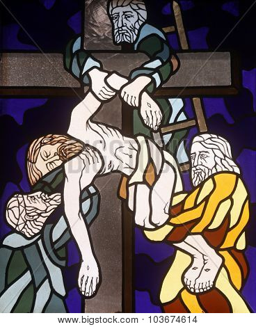 RIJEKA, CROATIA - JUNE 11: 13th Stations of the Cross, Jesus' body is removed from the cross, stained-glass window in the church of St. John the Baptist in Rijeka, Croatia, on June 11, 2011