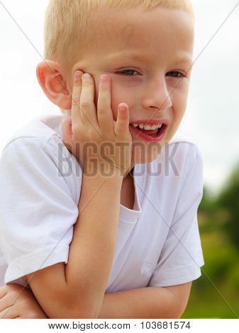 Pensive Boy Child Thinking And Daydreaming.