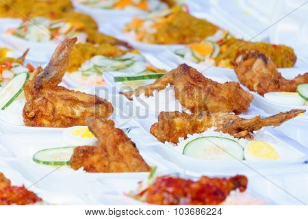 Fried Chicken, Rice And Cucumber Called Chiken Rice In Container With Selective Focus For Food Backg