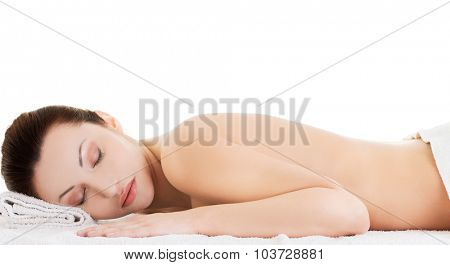 Woman lying on a towel ready to massage.