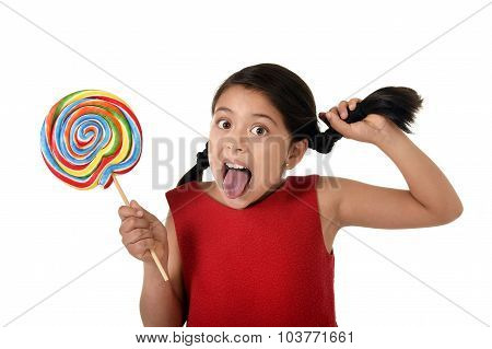 Happy Female Child Holding Big Lollipop Candy Pulling Pony Tail With Crazy Funny Face Expression