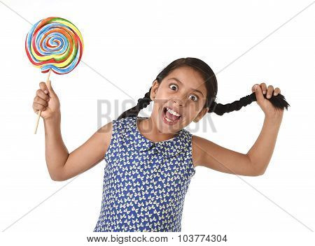 Happy Female Child Holding Big Lollipop Candy Pulling Pony Tail With Crazy Funny Face Expression In