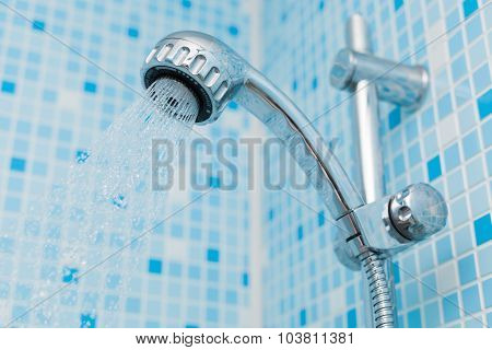 Head shower on blue background