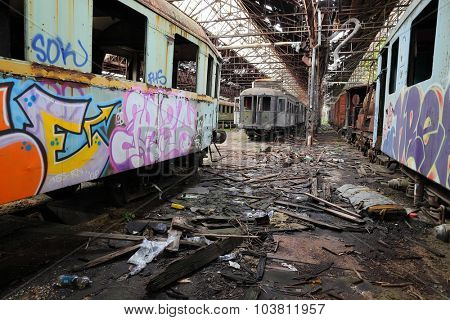 Abandoned train carriage in a decaying depo