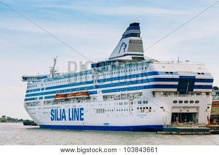 Modern ferry boat Silja Line at pier awaiting loading cargo