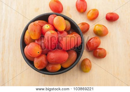 Tomoto Fruit In A Black Bowl