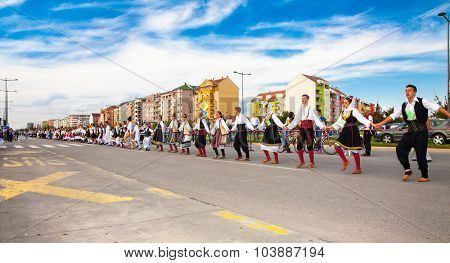 NOVI SAD, SERBIA-OCT 4, 2015: Guinness World Record Largest Folk Dance on Oct 4. 2015 in Novi Sad, Serbia. Over 12.000 participants break the Guinness World Record by simultaneously dancing a Kolo