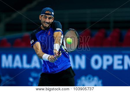 KUALA LUMPUR, MALAYSIA - SEPTEMBER 26, 2015: Luca Vanni of Italy plays his qualifying match in the Malaysian Open 2015 Tennis tournament held at the Putra Stadium, Malaysia.