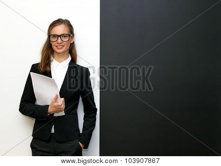 The Girl Wearing Glasses With Papers