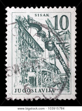 YUGOSLAVIA - CIRCA 1958: Stamp printed in Yugoslavia shows a Steel Plant, Sisak, with the same inscription, from series 