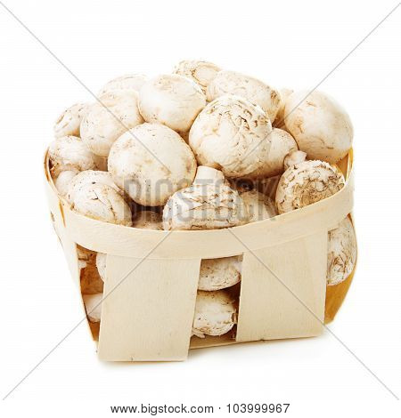 Mushrooms in a wooden box. Isolated on white background