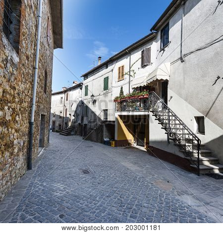 Village Trevinano located upon a hill near the borders of Lazio with the Tuscany and Umbria. Street in a old city without people and cars in Italy. Narrow street in the medieval italian town.