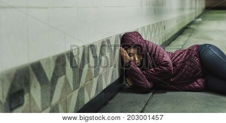 Homeless Woman Sleeping on The Floor