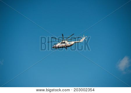 Khabarovsk, Russia - September 3, 2017: Mi-26 heavy military transport helicopter in flight in flight in the colors of the Ministry of emergency situations of Russia
