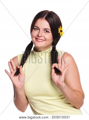 Pretty young woman coquets and smiles isolated on white background