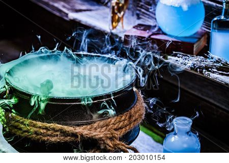 Closeup Of Witcher Cauldron With Blue Potions For Halloween