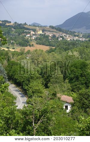 Rural landscape at summertime along the road of Tidone valley. View of Caminata