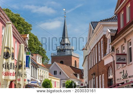 AURICH, GERMANY - JULY 18, 2017: Tower of the Lamberti church in the central street of Aurich, Germany