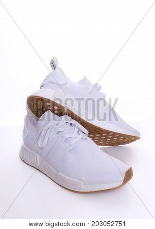 Kuala Lumpur, Malaysia - July 23, 2017: Rear view picture of a pair Adidas Original NMD R1 Gum Pack All White