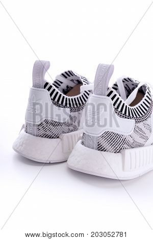 Kuala Lumpur, Malaysia - July 23, 2017: Rear view of Adidas NMD R1 Primeknit Oreo White Black Glitch Camo BY1911 sneaker on white background