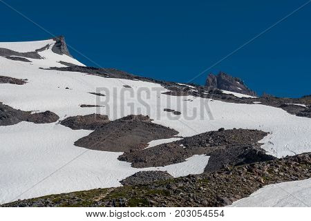 Mountaineers Cross Snow Field On Mount Rainier